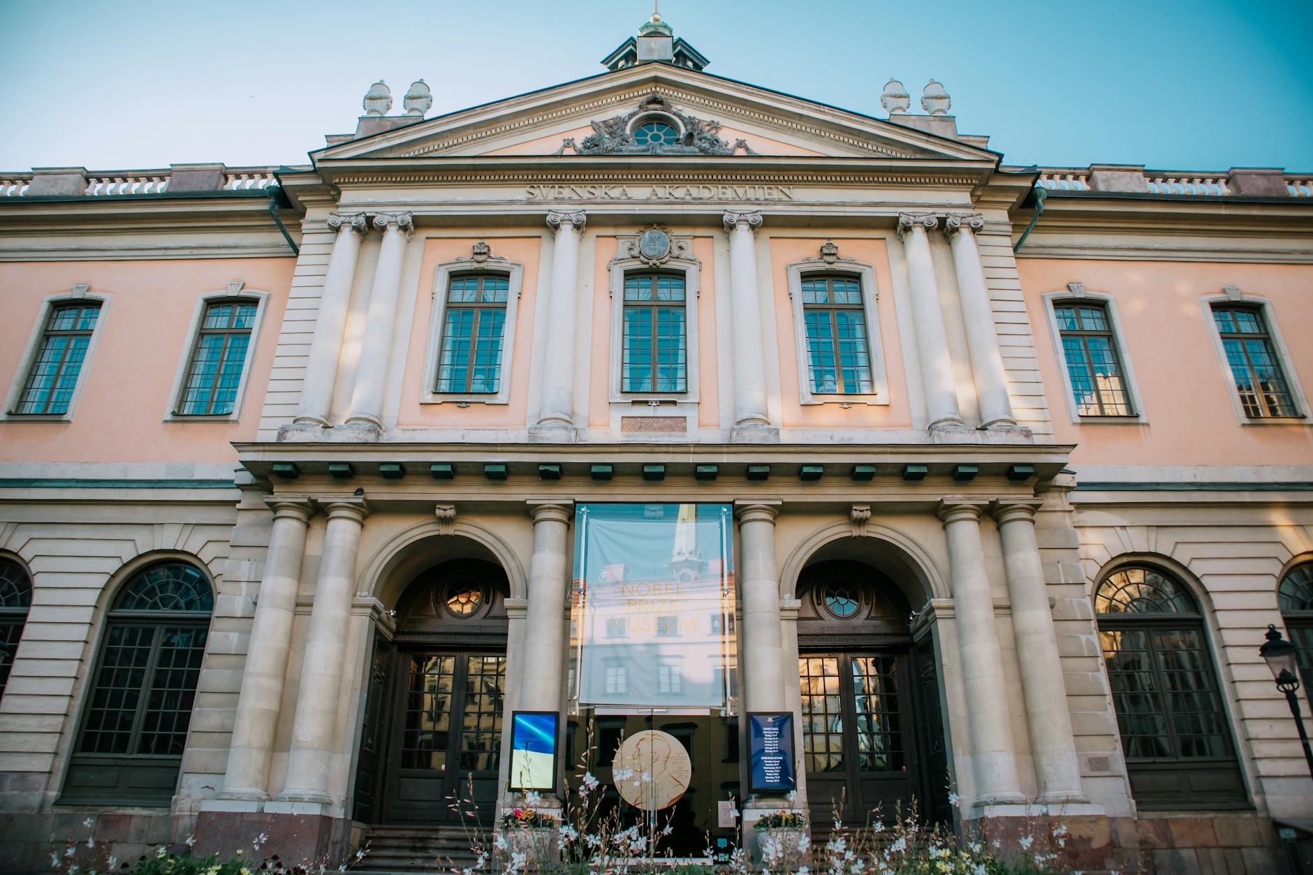 Front view of a historic neoclassical building with grand columns and architecture.