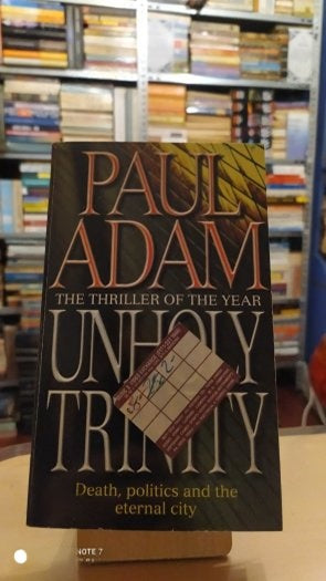 Unholy Trinity - Paul Adam kitap kapağı