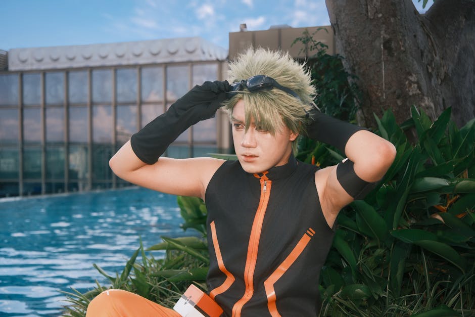 A cosplayer poses in character by a poolside, showcasing detailed costume design.