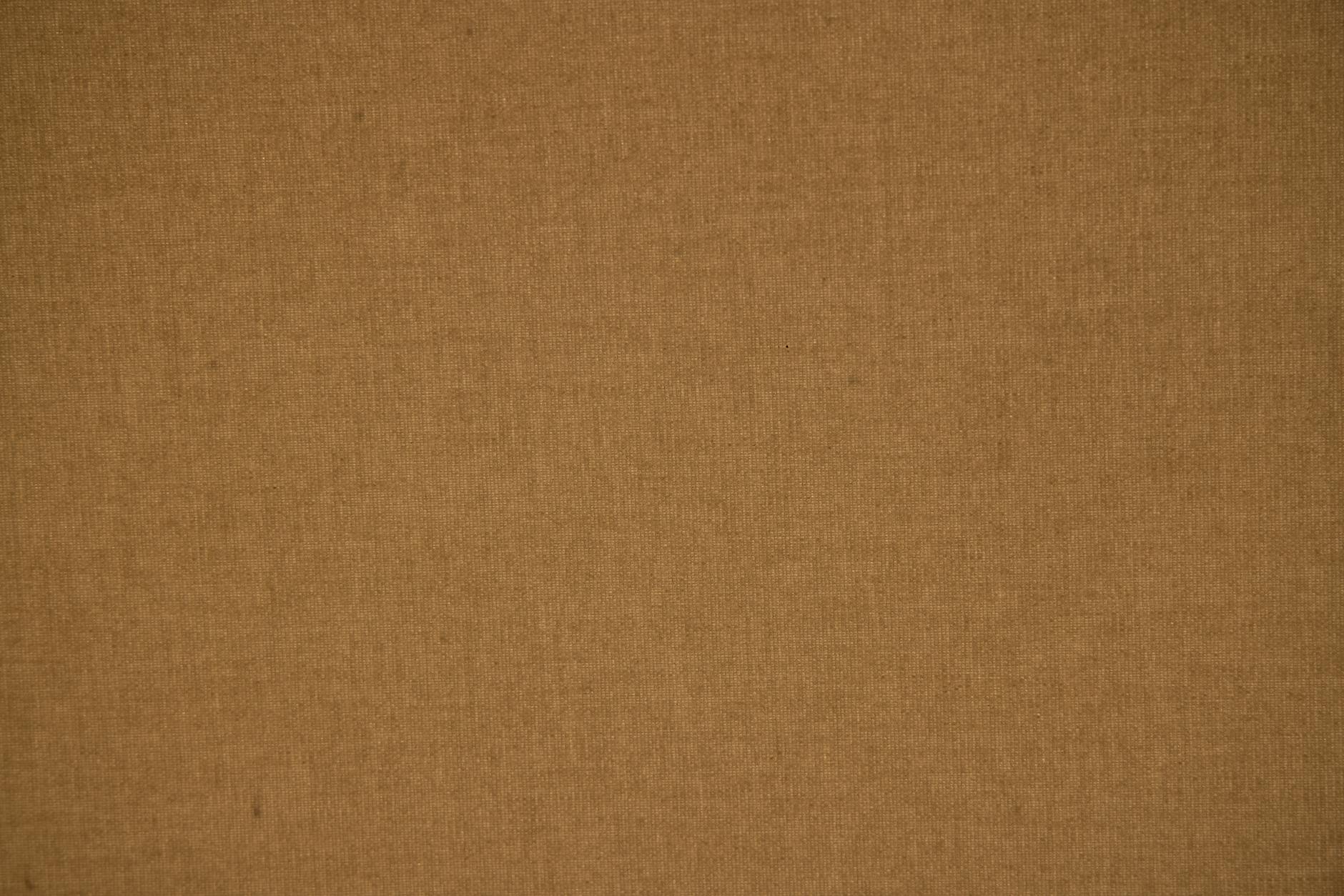 Detailed close-up of a brown textile fabric showing its texture and pattern.