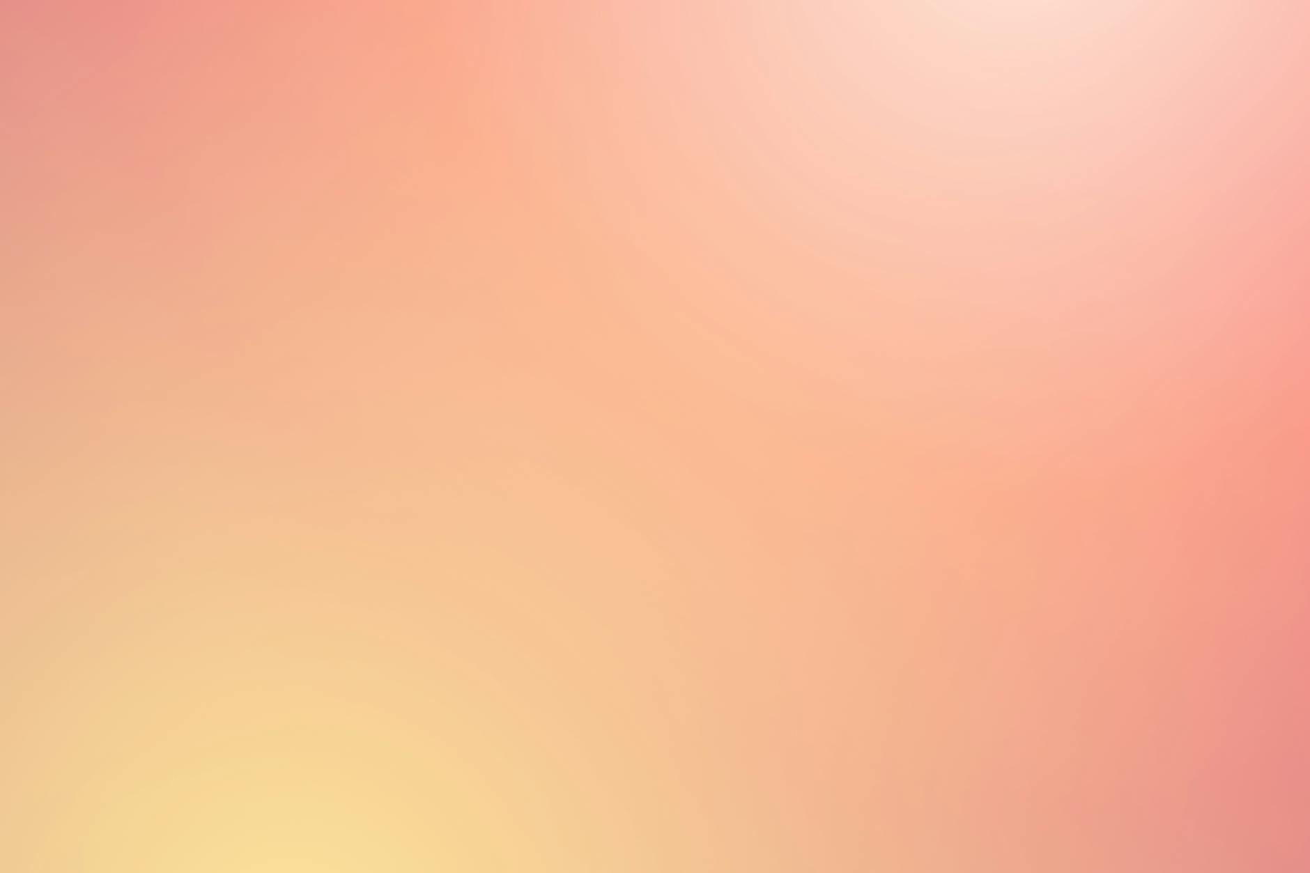 Soft abstract gradient background in pink and yellow hues