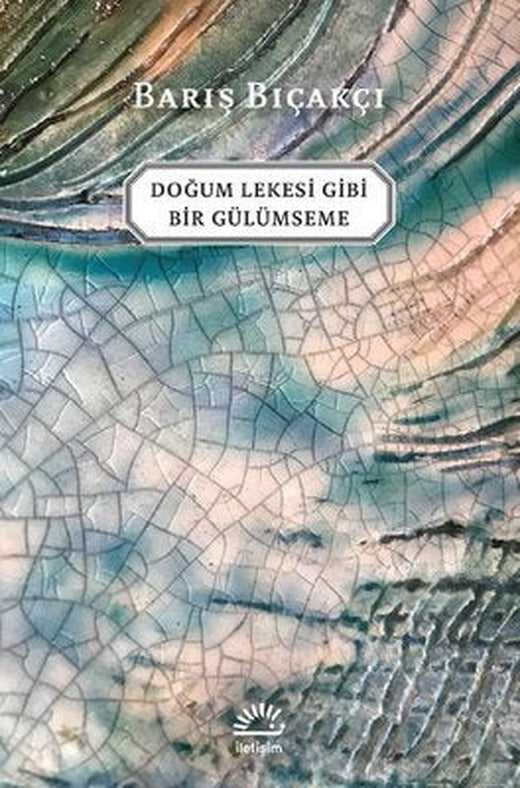 Doğum Lekesi Gibi Bir Gülümseme | İletişim Yayınları
